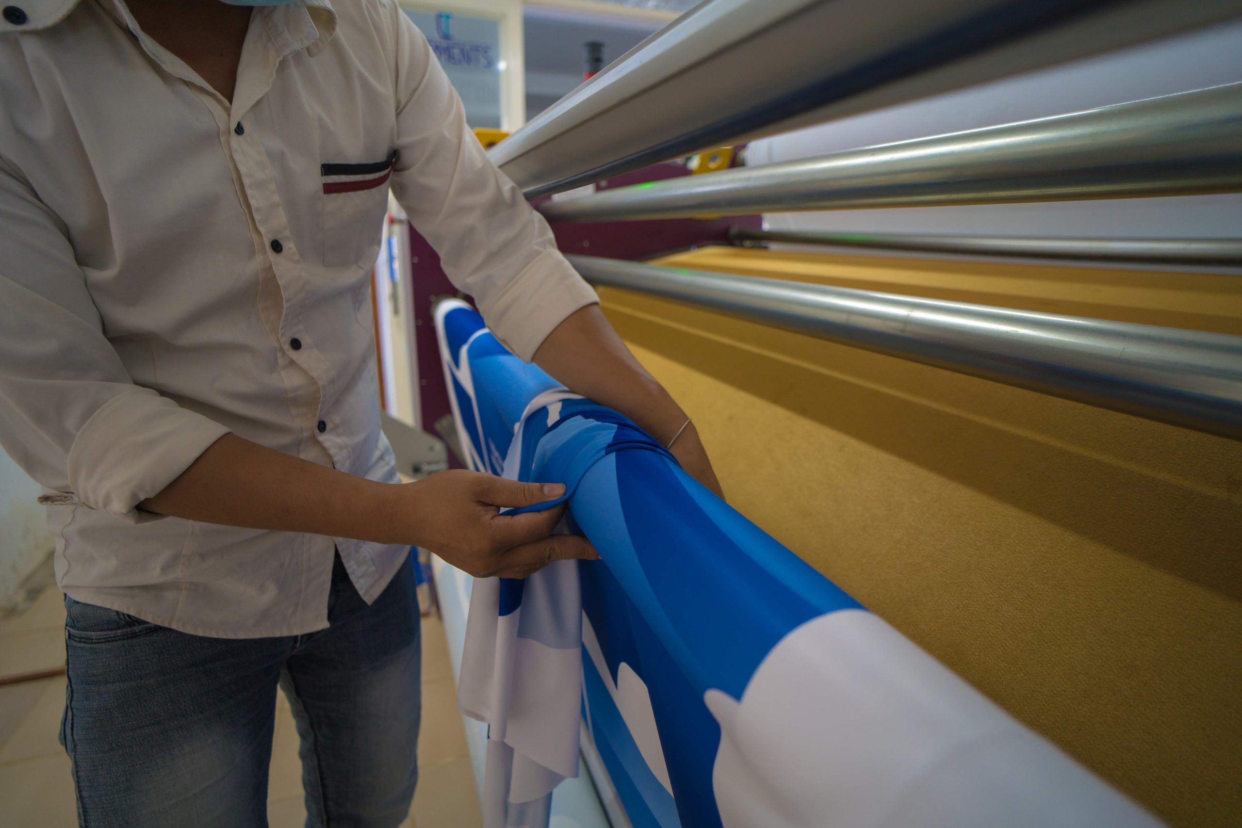 young-asian-male-worker-technician-wearing-medical-mask-make-object-sublimation-heat-press