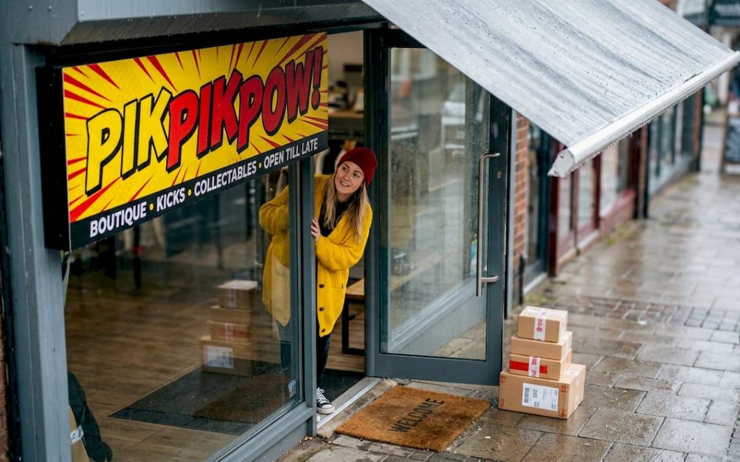 Shop owner checks durable outdoor shop sign