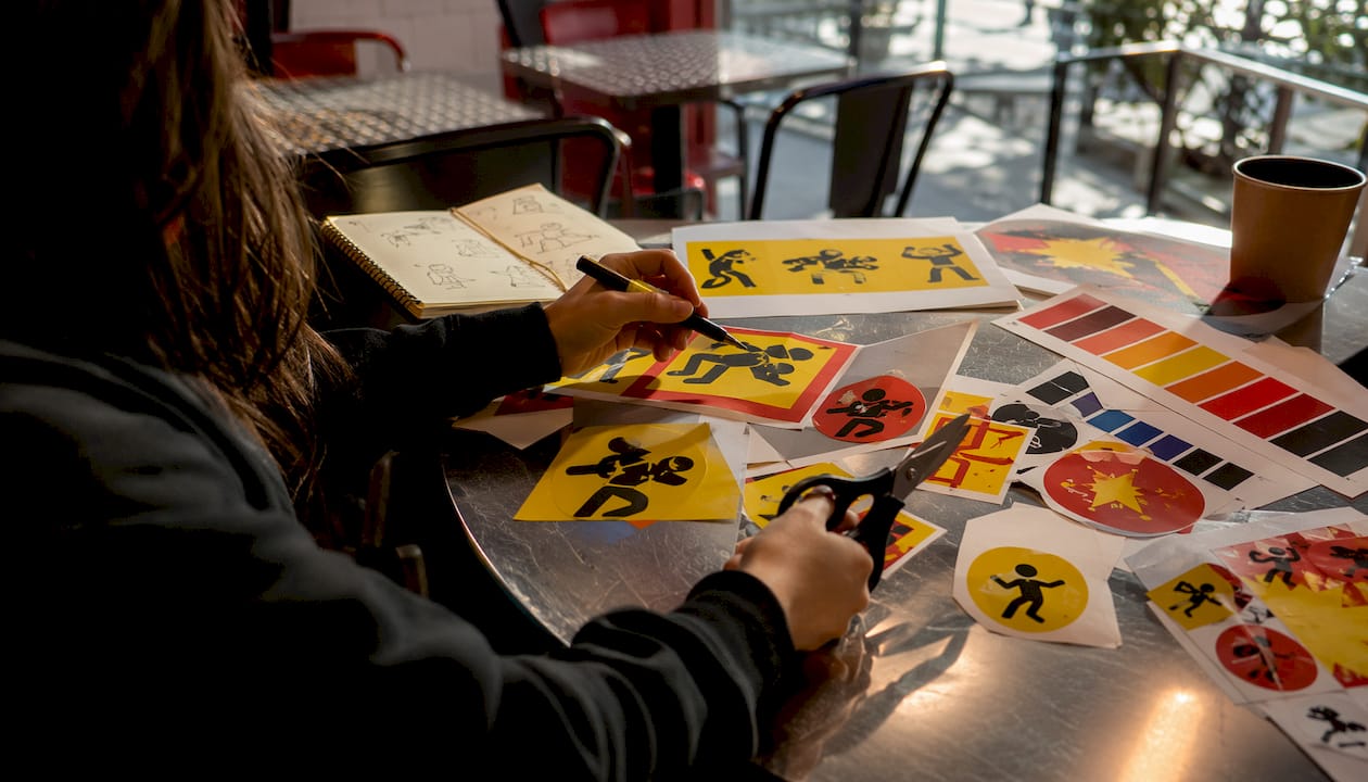Graphic designer reviewing gym signage materials